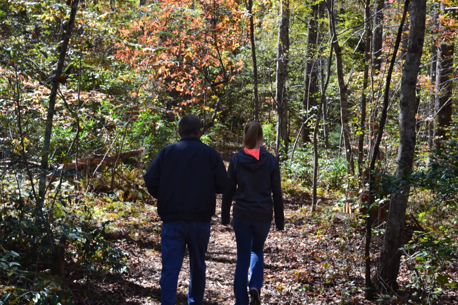 My husband and daughter walk down a path blazing with autumn colors. I am thankful for them during this fall season.